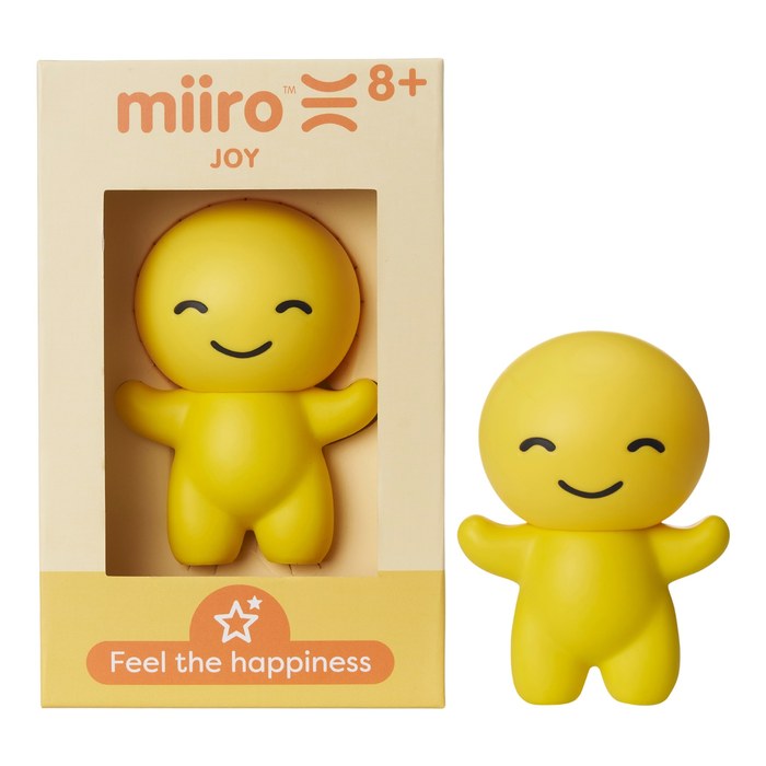 A Joy box with the figure displayed beside it.